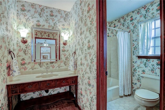 full bathroom with ceiling fan, vanity, shower / bath combo, tile patterned floors, and toilet