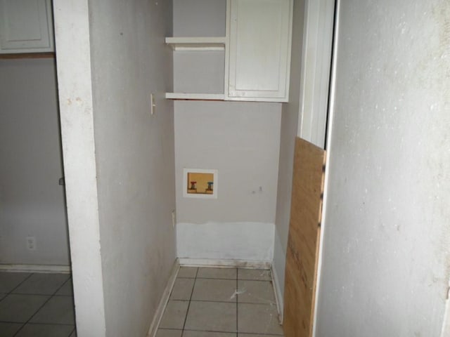 laundry area featuring hookup for a washing machine and light tile patterned floors