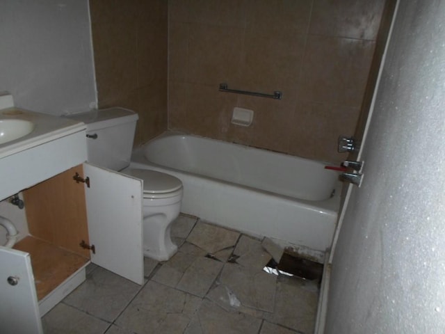 bathroom with tile patterned floors, vanity, and toilet