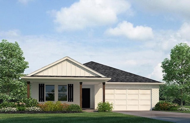 view of front of home featuring a front yard and a garage