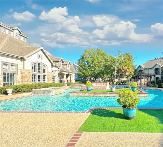 view of pool featuring a patio