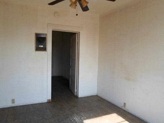 unfurnished room with ceiling fan