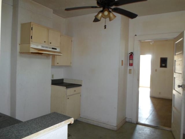 kitchen with cream cabinetry and ceiling fan