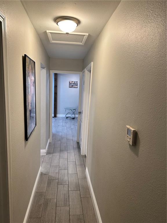 hallway featuring hardwood / wood-style floors