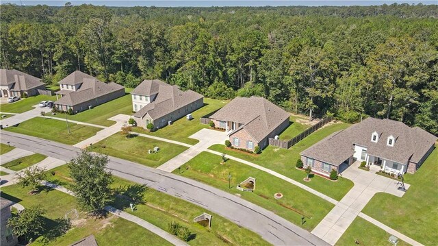 640 Pine Grove Loop, Madisonville, LA 70447 - aerial view of residential area featuring a heavily wooded area