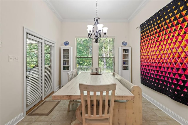 640 Pine Grove Loop, Madisonville, LA 70447 - tiled dining room with a chandelier and ornamental molding
