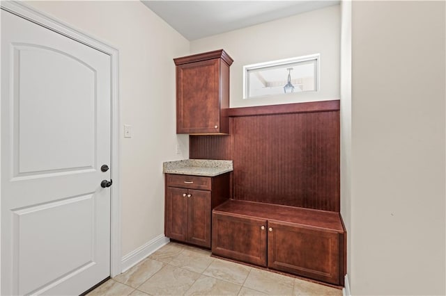 mudroom with light tile patterned flooring