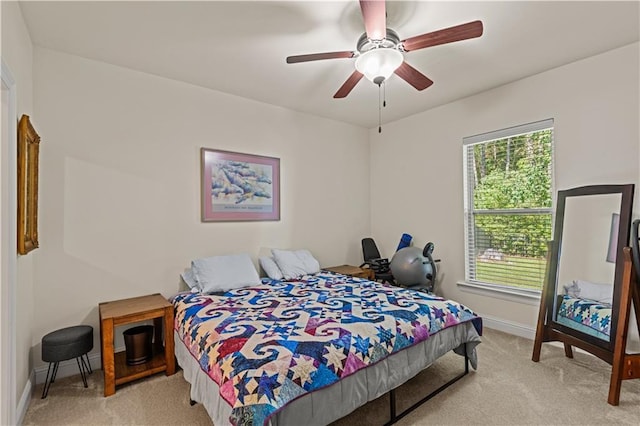 640 Pine Grove Loop, Madisonville, LA 70447 - bedroom with light colored carpet and ceiling fan