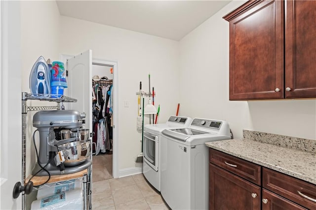 640 Pine Grove Loop, Madisonville, LA 70447 - laundry area with cabinet space, separate washer and dryer, and light tile patterned floors