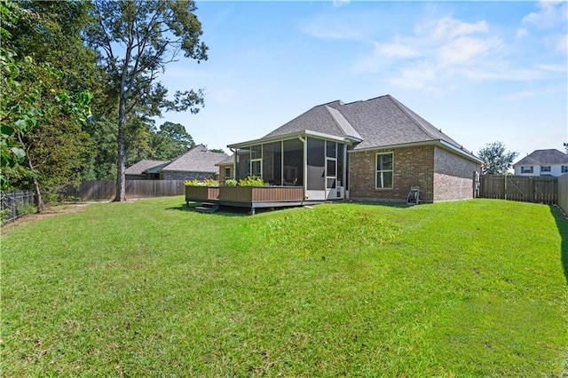 640 Pine Grove Loop, Madisonville, LA 70447 - back of property with a sunroom, a fenced backyard, and brick siding