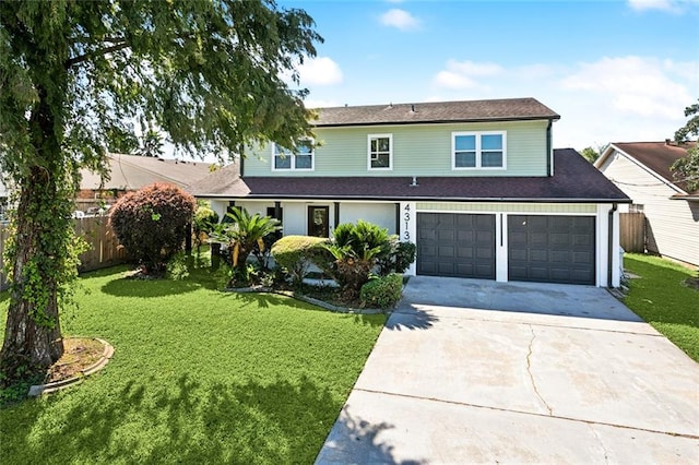 view of front property featuring a front yard and a garage