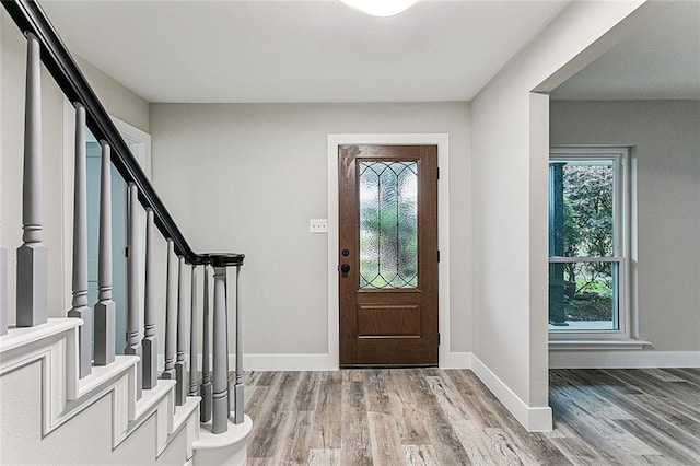 entryway featuring hardwood / wood-style flooring and plenty of natural light