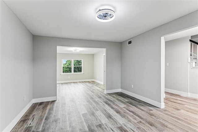 spare room featuring light wood-type flooring