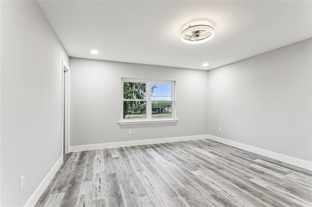 empty room with light hardwood / wood-style floors