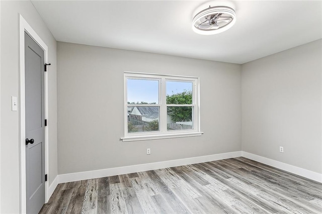 spare room featuring light hardwood / wood-style floors