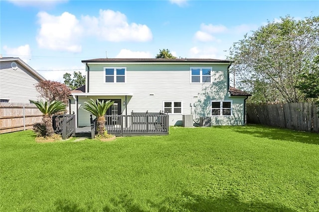 back of house featuring a yard and a deck