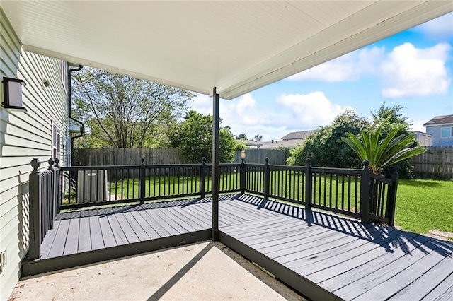 wooden deck with a lawn