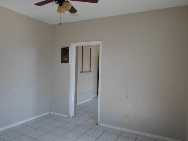 spare room featuring ceiling fan and light tile patterned flooring