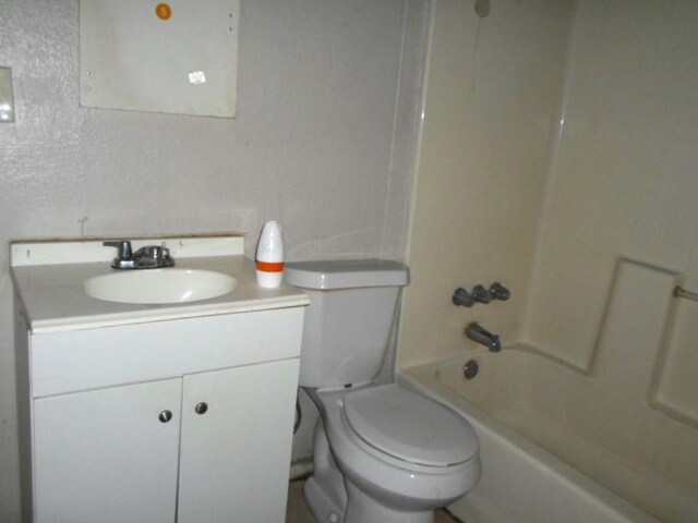 full bathroom featuring shower / bath combination, vanity, and toilet