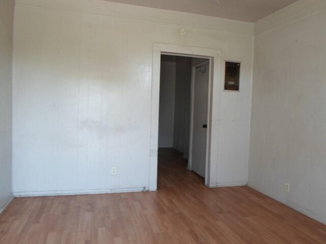 unfurnished room featuring light hardwood / wood-style floors