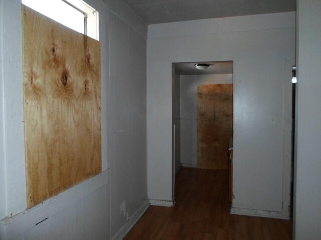 hallway featuring dark wood-type flooring