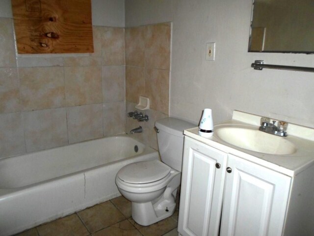 full bathroom with vanity, tile patterned flooring, toilet, and washtub / shower combination