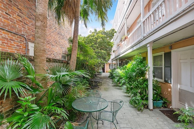 view of patio featuring a balcony