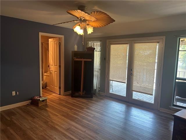 interior space with ceiling fan, dark wood-type flooring, and french doors