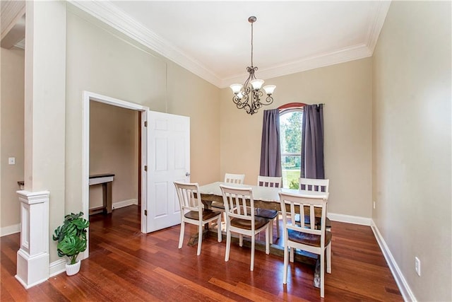 dining room with an inviting chandelier, dark hardwood / wood-style floors, and crown molding