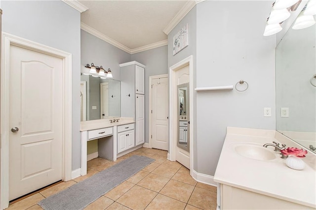 bathroom with ornamental molding, tile patterned floors, and vanity