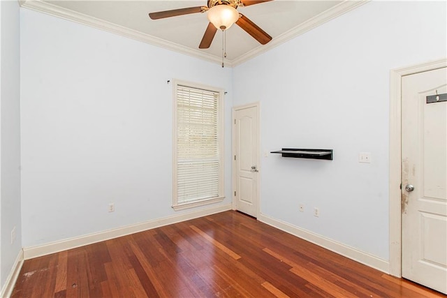 spare room featuring ornamental molding, ceiling fan, and dark hardwood / wood-style floors