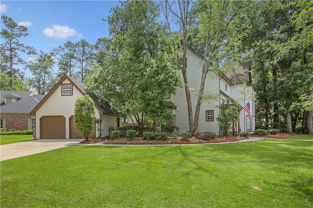 view of front of house with a garage and a front yard