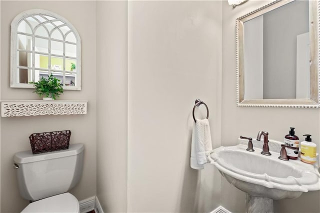 bathroom featuring sink and toilet