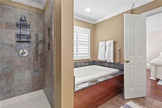 bathroom featuring wood-type flooring, separate shower and tub, and crown molding