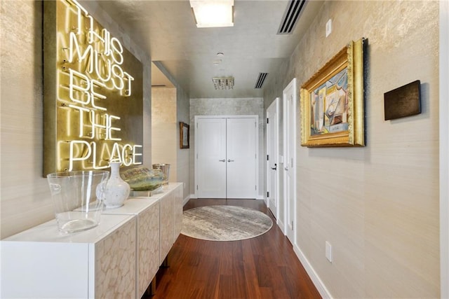 hallway with hardwood / wood-style floors