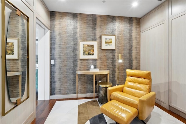 sitting room featuring dark hardwood / wood-style flooring