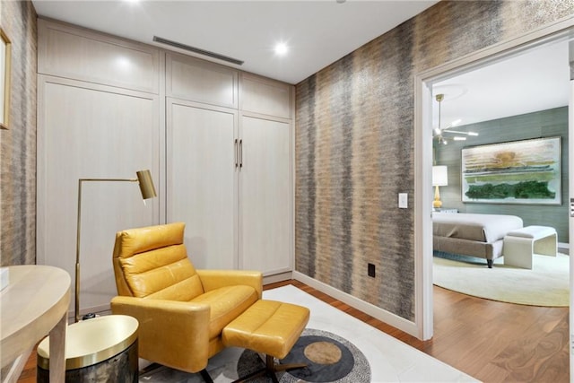 living area with light hardwood / wood-style flooring