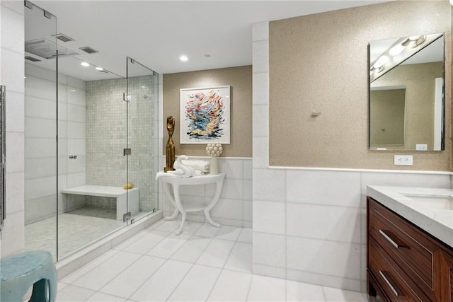 bathroom with vanity, tile patterned floors, and walk in shower