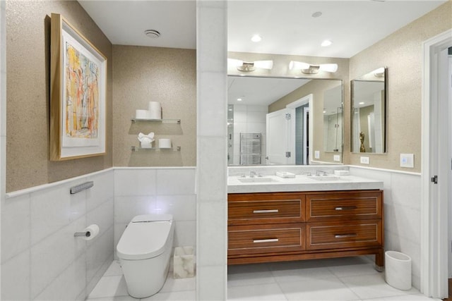 bathroom with tile patterned flooring, vanity, and toilet