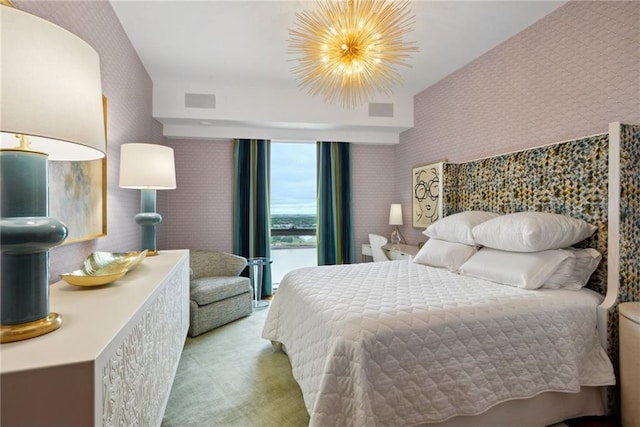 carpeted bedroom with a chandelier