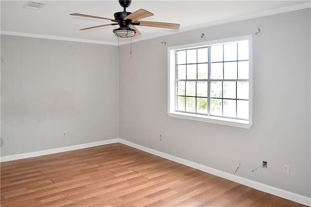 unfurnished room with crown molding, light wood-type flooring, and ceiling fan