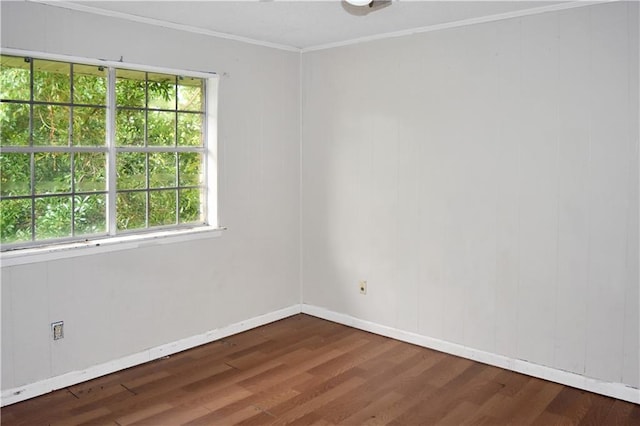 unfurnished room with crown molding and dark hardwood / wood-style floors