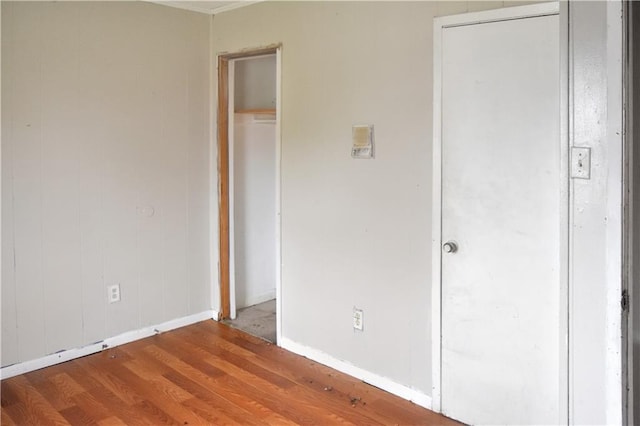 unfurnished bedroom featuring hardwood / wood-style floors