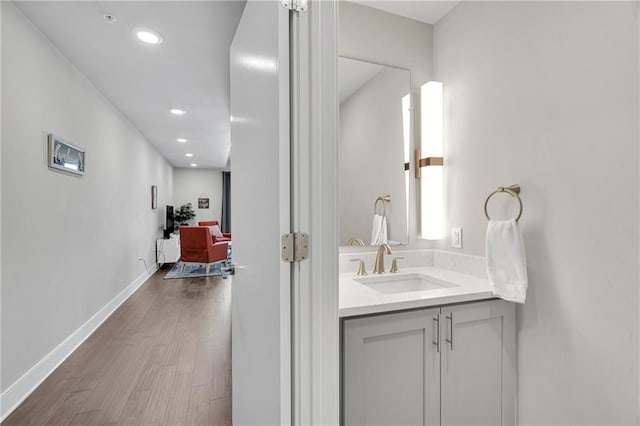 bathroom featuring wood-type flooring and vanity