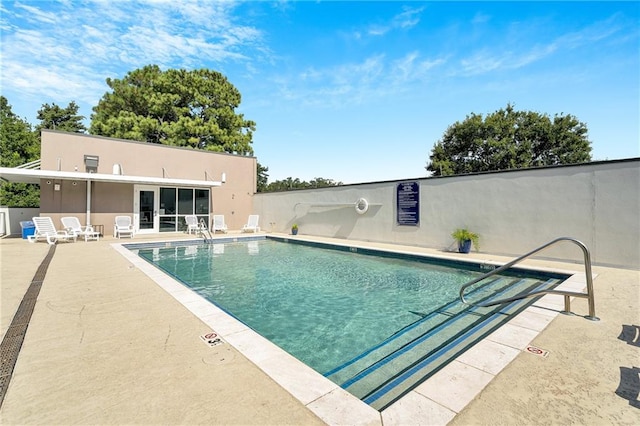 view of pool featuring a patio