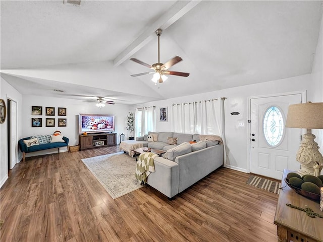 living room with hardwood / wood-style floors, lofted ceiling with beams, and ceiling fan