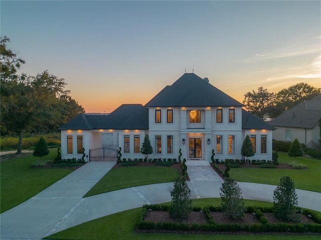 view of front of property with a yard