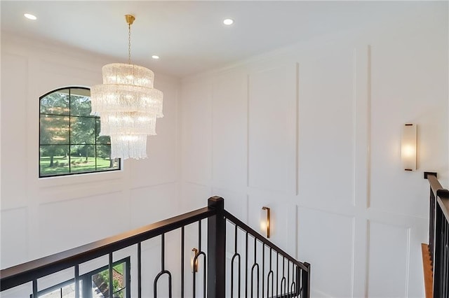 hallway featuring an inviting chandelier