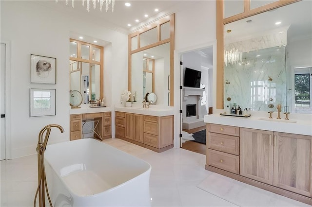 bathroom featuring independent shower and bath, vanity, crown molding, and tile patterned floors