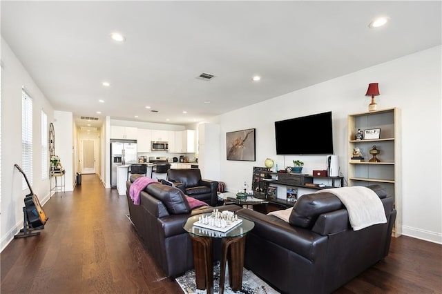 living room featuring dark hardwood / wood-style floors